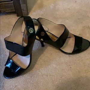 Black opened toed shoe with MK logo